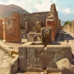 ancient-water-well-in-pompeii-on-mount-vesuvius-background-campania-picture-id1144757999