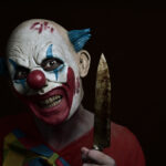 scary evil clown with a knife