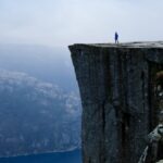 travel-to-norway-person-looking-on-the-fjords-picture-id497256652