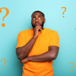 Confuse and pensive expression of a boy with many questions . cyan colored background