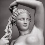 White marble young woman isolated on black background. Venus (Aphrodite) goddess of love for interior posters, prints, wallpapers, design, cover. Historic heritage, sample of female beauty, classicism