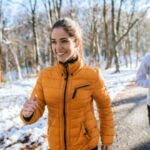 fitness-couple-winter-morning-exercise-at-snowy-mountain-picture-id1049942982