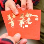 father-giving-red-pockets-to-the-son-translation-of-the-chinese-are-picture-id1201813088